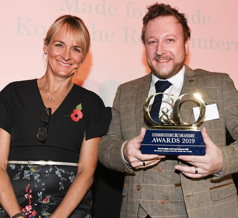 Ashley Gaunt, Head of Design accepting the C&O award from BBC's Louise Minchin