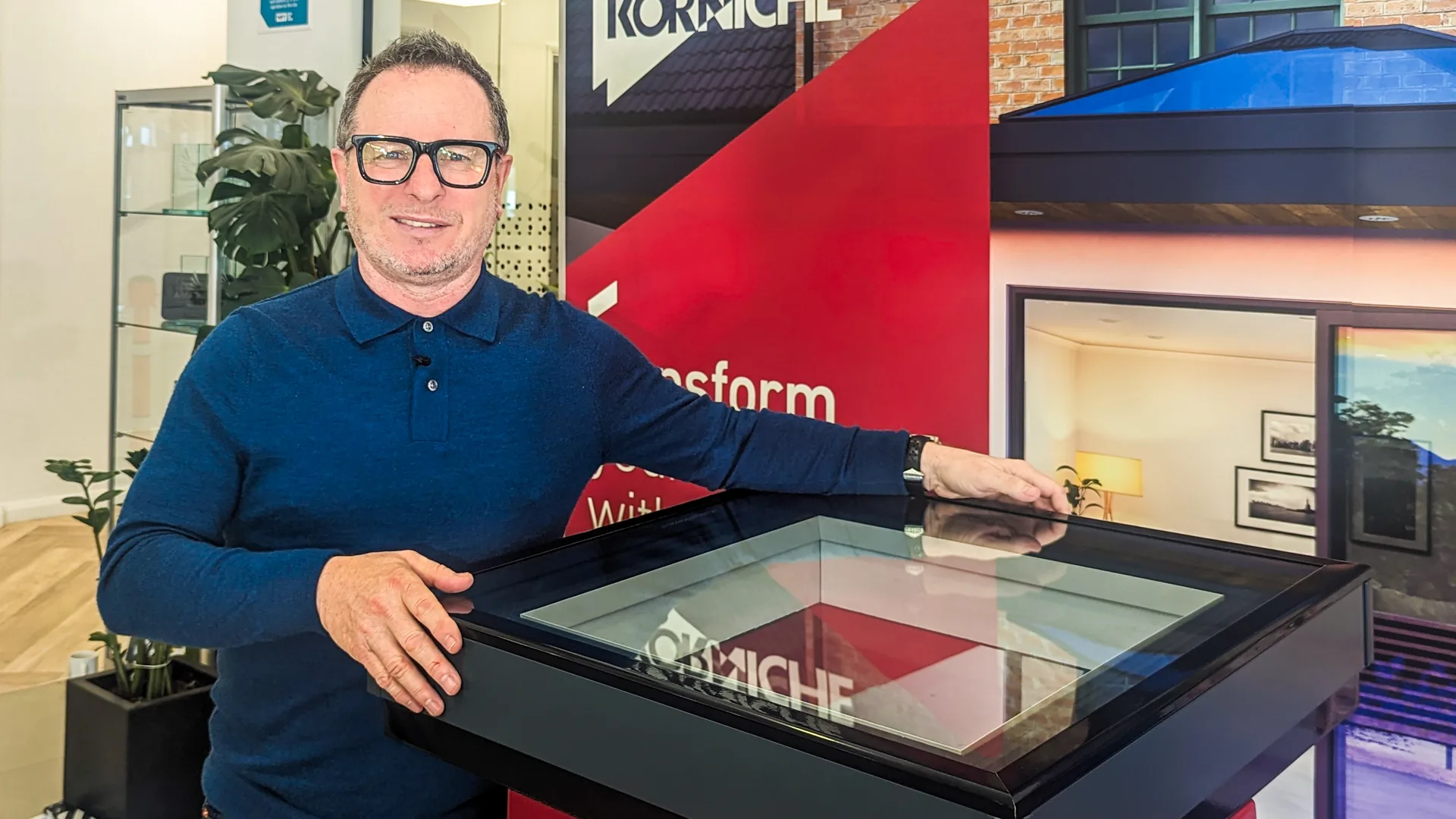 Mark Millar standing next to the Korniche Flat Glass Rooflight