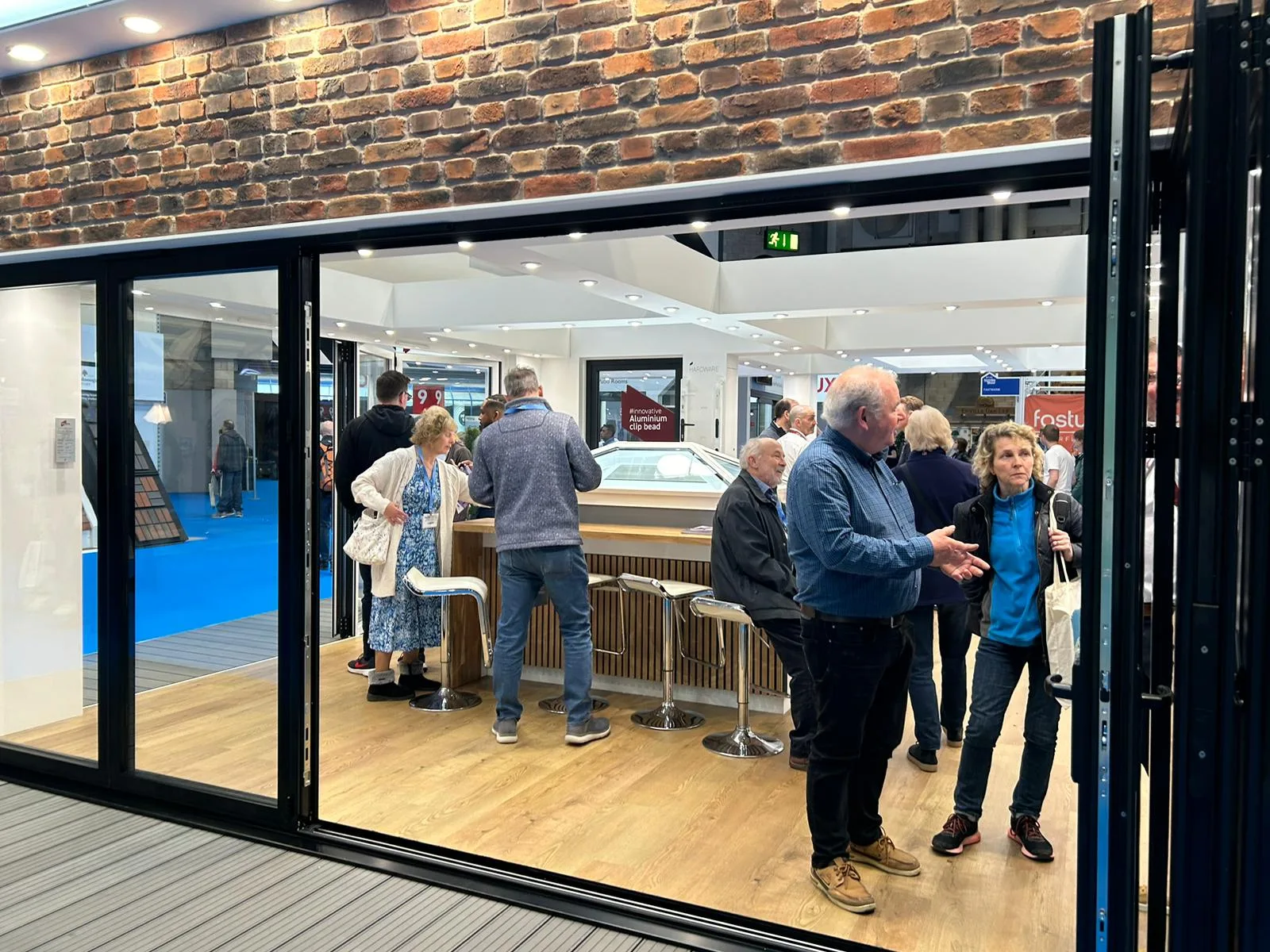 Expert Advice and Roof Lanterns at the Korniche Stand Attendees at the National Homebuilding & Renovating Show chat with the friendly Korniche team while examining a roof lantern.