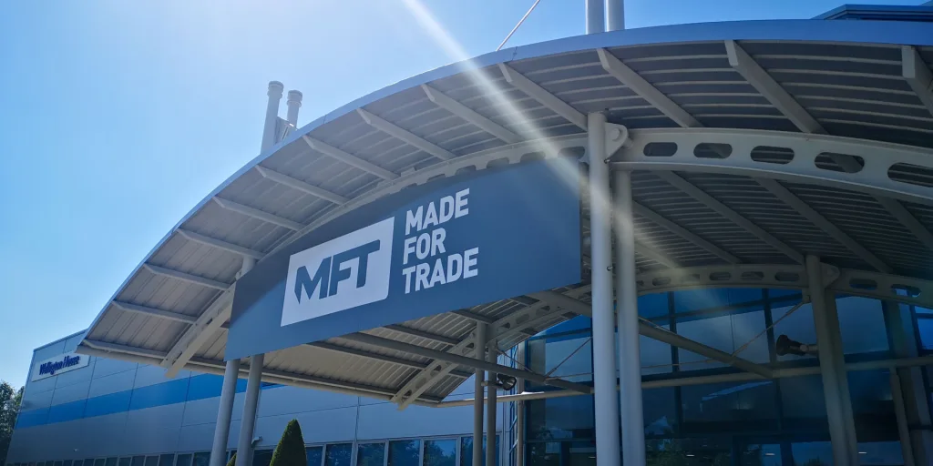 Made for Trade Building with Logo (MFT) on a sunny day.