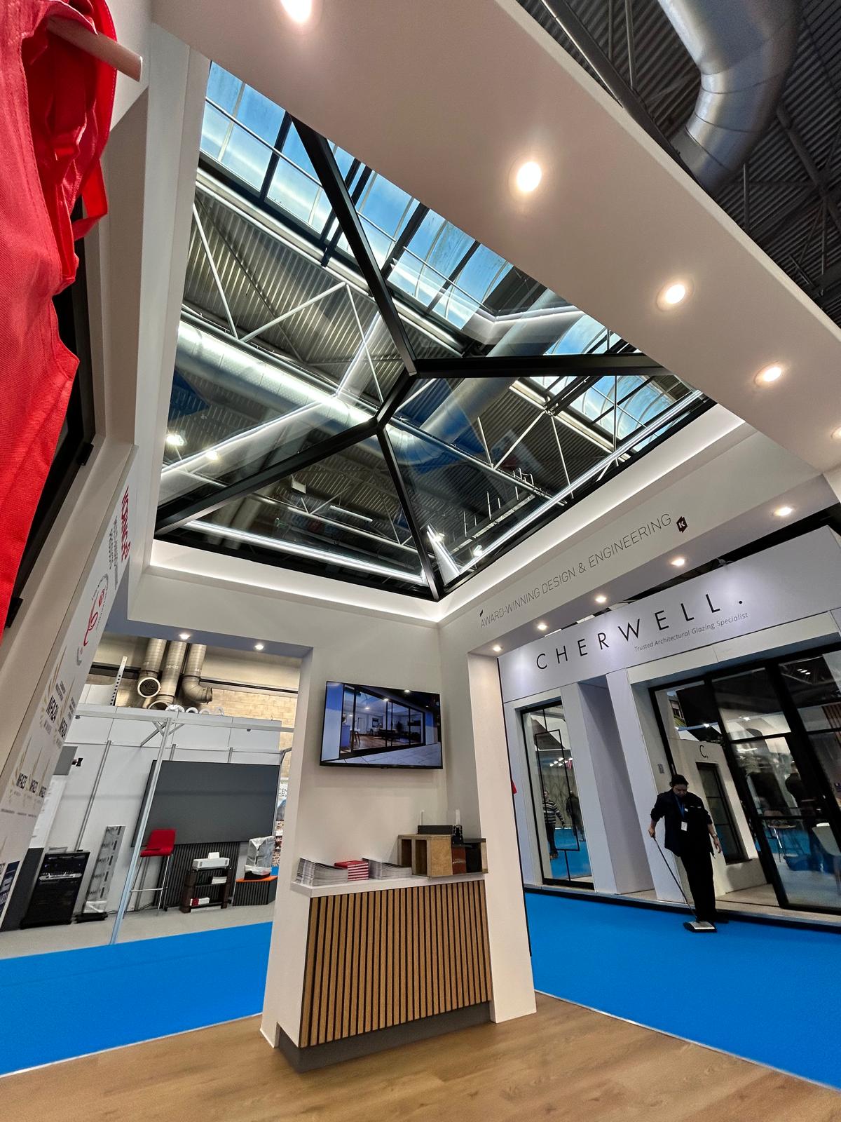 Black Korniche Roof Lantern, with "Award Winning Design & Engineering" signage at the National Homebuilding & Renovating Show 2025.