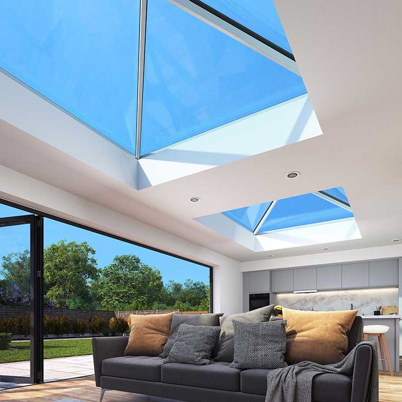 Bathed in Light Korniche Roof Lantern Interior View Interior view showcasing two Korniche Roof Lanterns allowing bright blue sky and natural daylight to fill a modern living space.