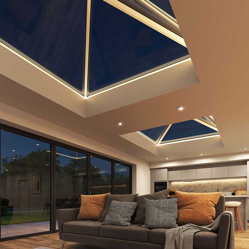 Evenings Aglow Korniche Roof Lanterns with Integrated LED Lighting Interior view of two Korniche Roof Lanterns at night, illuminated by integrated LED lighting, casting a warm glow over the living space.