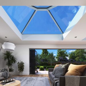 Skyward View: Experiencing the Korniche Roof Lantern from Below Interior view looking directly up at a Korniche Roof Lantern, showcasing the bright blue sky and the slim white internal frame.