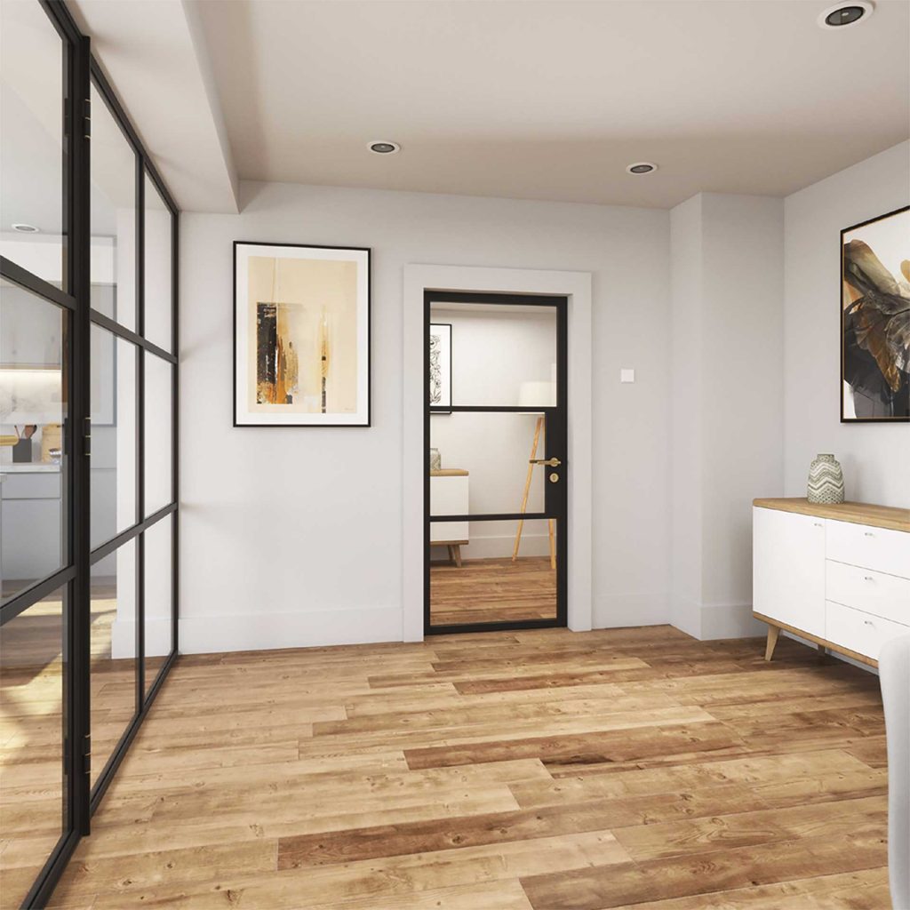 Korniche single glass door with a black frame, part of a glass partition system, installed in a home in Stockton-on-Tees, England. The door features horizontal glazing bars and gold hardware, providing a view into an adjacent room with light-coloured furniture.