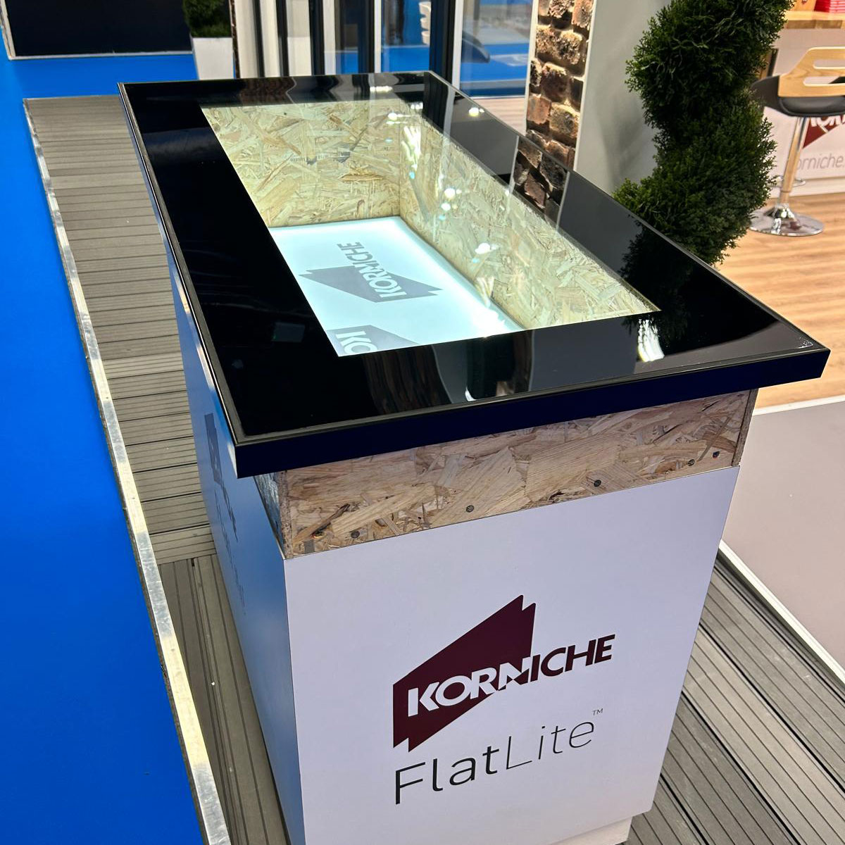 See the Slimmer, Stronger FlatLite The New Korniche FlatLite Rooflight on display at the show, highlighting its exceptionally thin black framing profile.