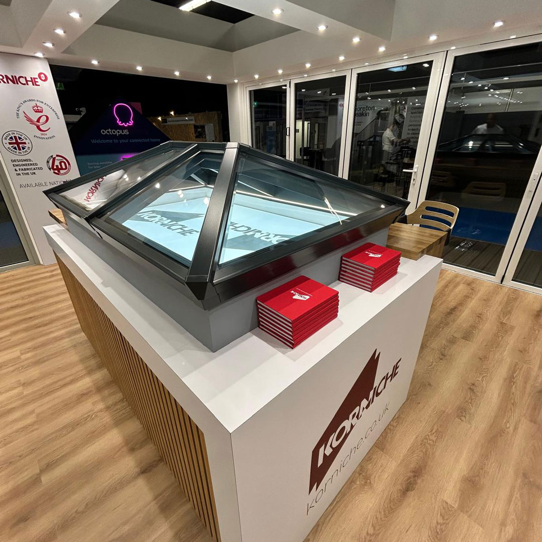 The New, Improved Korniche Roof Lantern A detailed view of the new Korniche Roof Lantern installed on the exhibition stand, showcasing its slimmer rafters and modern aesthetics.