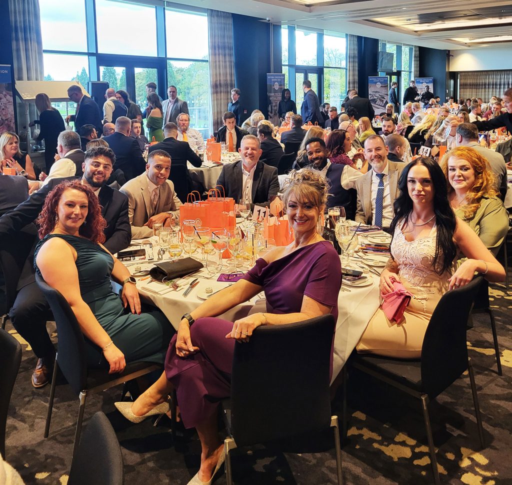 Korniche Made for Trade team at National Fenestration Awards (NFAs) table celebrating winning Bi-folding Door Manufacturer of the Year