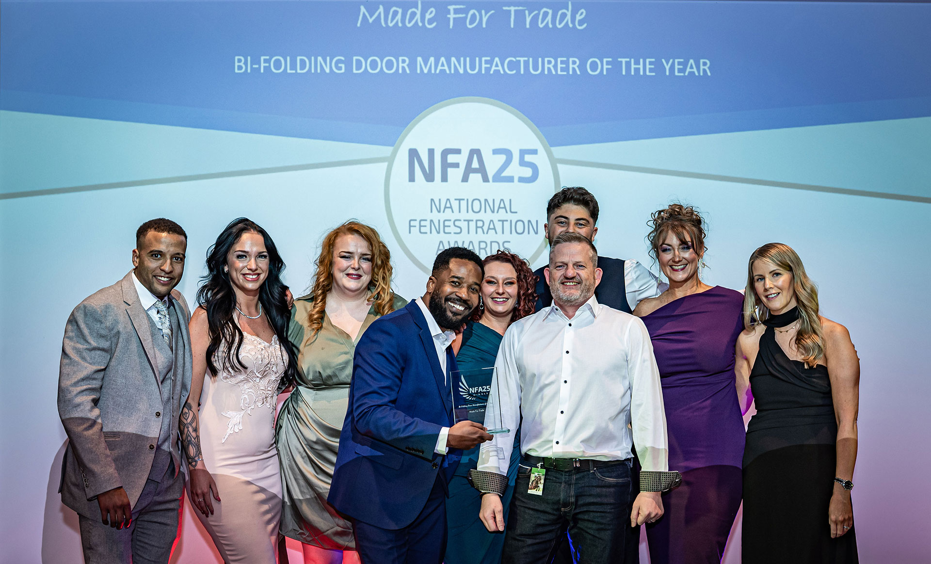 Korniche Wins Bi-folding Door Manufacturer of the Year at NFAs Korniche Made for Trade team on stage accepting National Fenestration Award for Bi-folding Door Manufacturer of the Year
