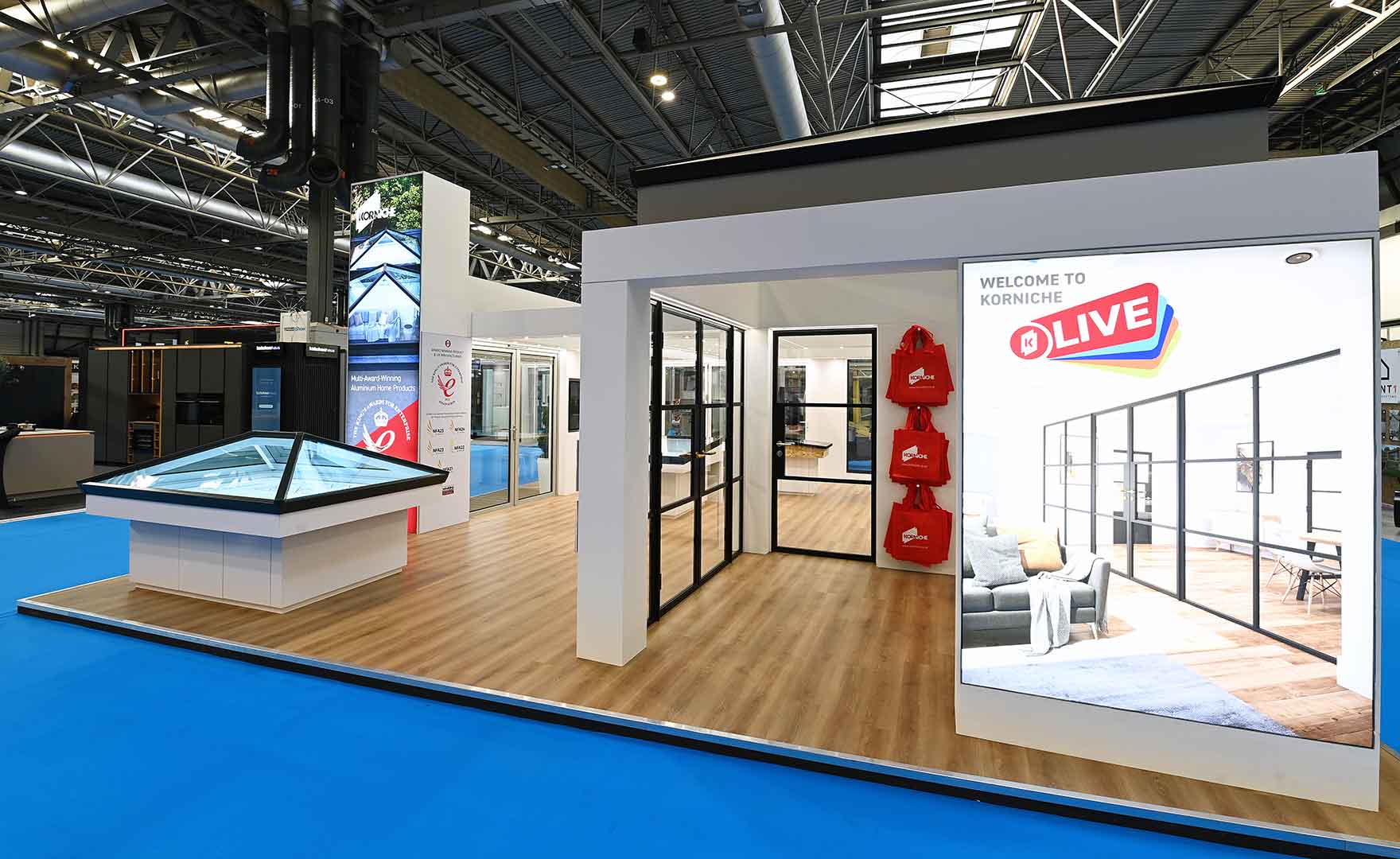 Korniche stand at Homebuilding and Renovating Show featuring roof lantern, French doors and internal glass partitions